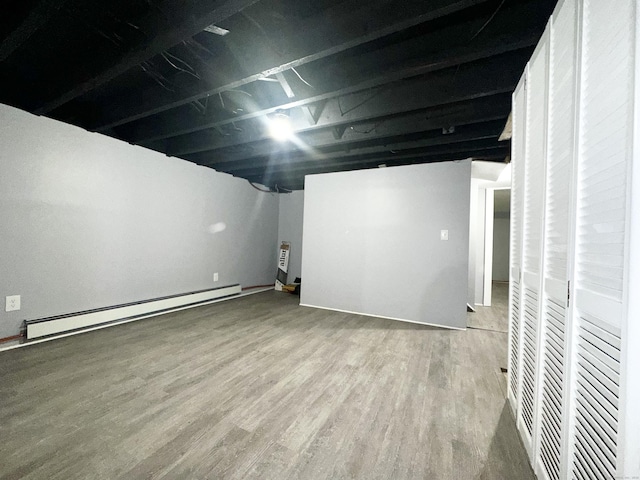 65 Beach St, Bridgeport, CT 06608 - finished below grade area with wood finished floors and a baseboard radiator