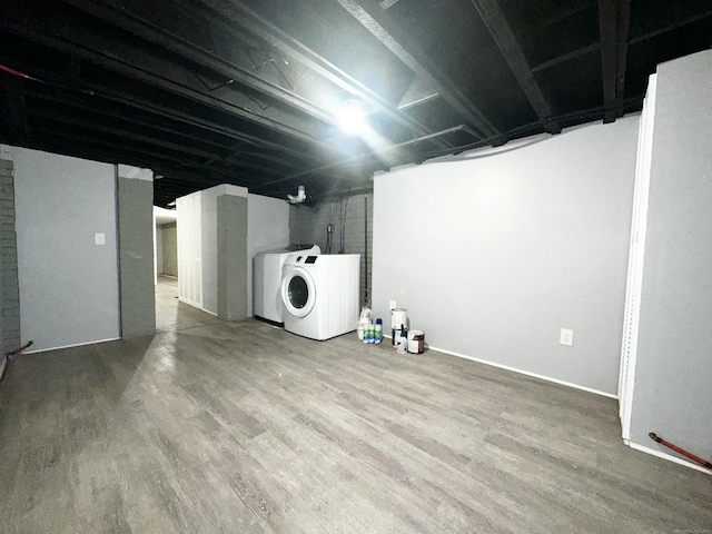65 Beach St, Bridgeport, CT 06608 - basement with wood finished floors and washer / clothes dryer