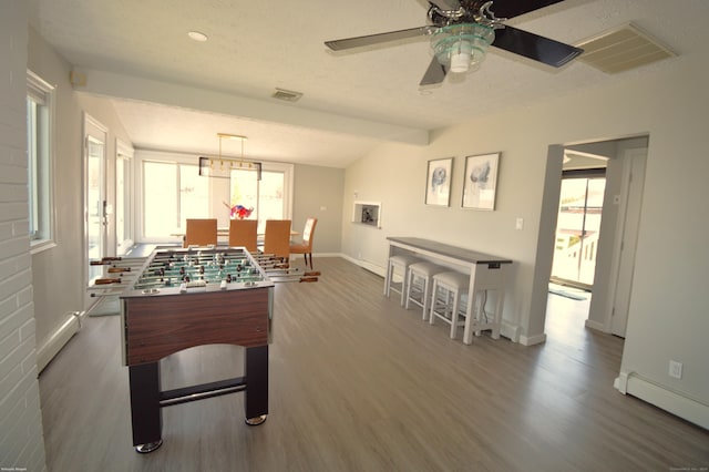 12 W Point Rd, East Hampton, CT 06424 - recreation room featuring dark wood-style flooring, a ceiling fan, visible vents, and baseboard heating