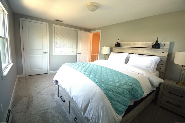 12 W Point Rd, East Hampton, CT 06424 - carpeted bedroom featuring visible vents, baseboards, and baseboard heating