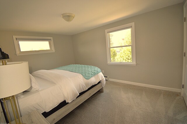 12 W Point Rd, East Hampton, CT 06424 - carpeted bedroom featuring baseboards, a baseboard heating unit, and multiple windows