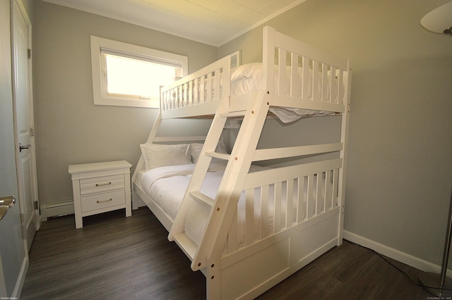 12 W Point Rd, East Hampton, CT 06424 - bedroom with baseboards, a baseboard heating unit, and dark wood finished floors