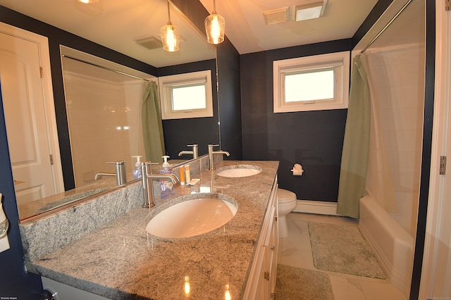 12 W Point Rd, East Hampton, CT 06424 - full bathroom with a sink, shower / bath combo with shower curtain, toilet, and double vanity