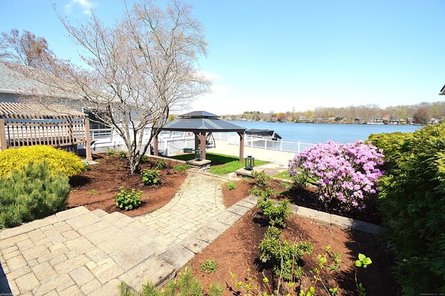 12 W Point Rd, East Hampton, CT 06424 - view of patio with a water view, a gazebo, and fence