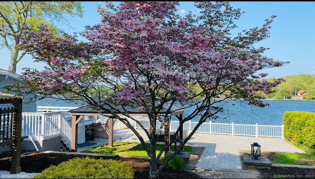 12 W Point Rd, East Hampton, CT 06424 - exterior space featuring fence, a gazebo, a water view, and a patio area