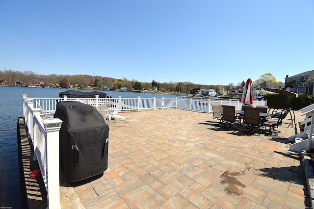 12 W Point Rd, East Hampton, CT 06424 - view of patio / terrace with outdoor dining area, a water view, and fence