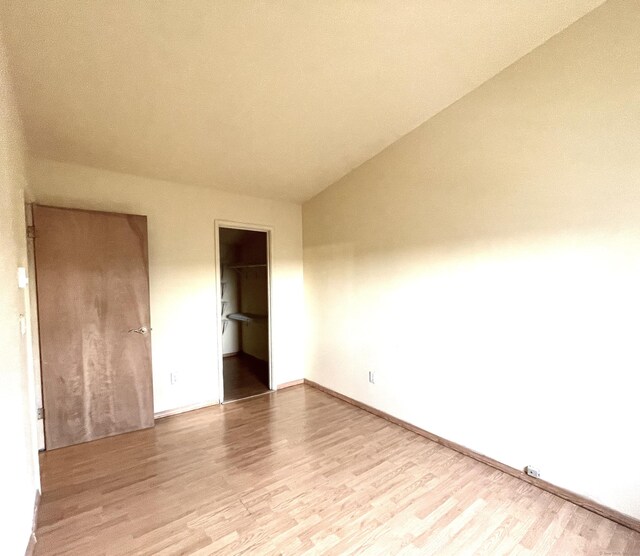 6 Stirling Ct, Middletown, CT 06457 - unfurnished bedroom featuring a spacious closet, wood finished floors, and baseboards