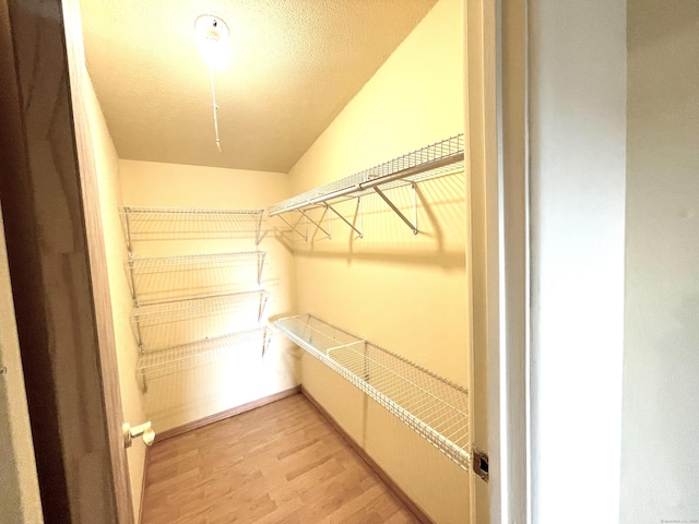 6 Stirling Ct, Middletown, CT 06457 - spacious closet with light wood-style floors and vaulted ceiling
