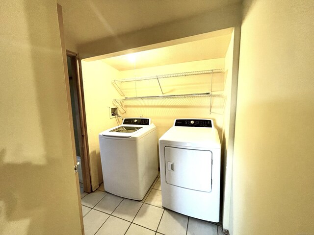 6 Stirling Ct, Middletown, CT 06457 - laundry room featuring light tile patterned flooring, laundry area, and washer and clothes dryer