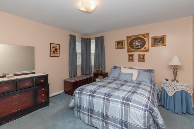 carpeted bedroom with baseboards