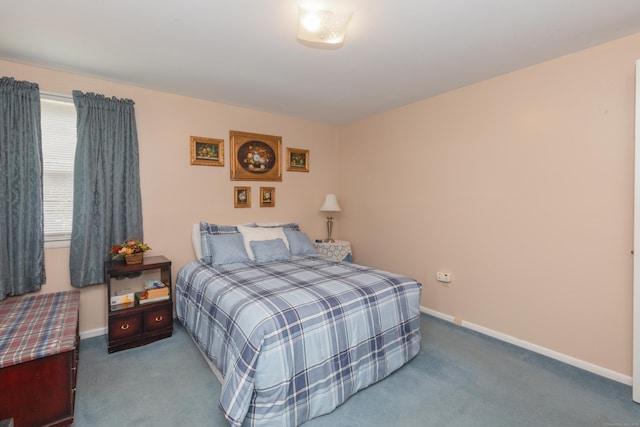 carpeted bedroom with baseboards