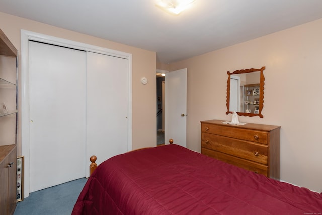 carpeted bedroom with a closet