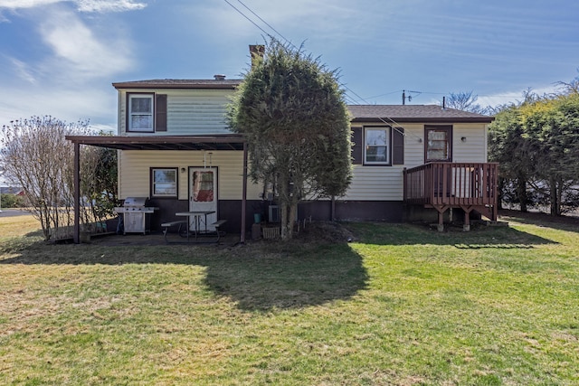 back of house with a lawn and covered porch