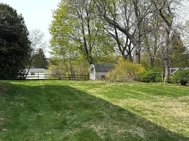 30 Merrimac St, Watertown, CT 06779 - view of yard with fence, a storage shed, and an outbuilding