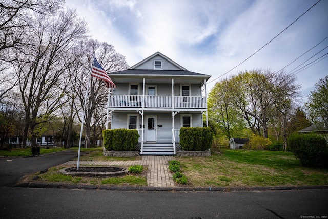 30 Merrimac St, Watertown, CT 06779 - view of front of house featuring a porch, a front lawn, and a balcony