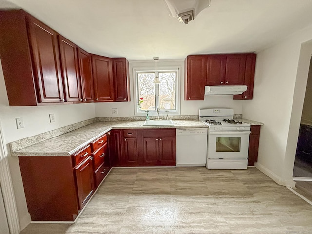 30 Merrimac St, Watertown, CT 06779 - kitchen with reddish brown cabinets, white appliances, under cabinet range hood, and a sink