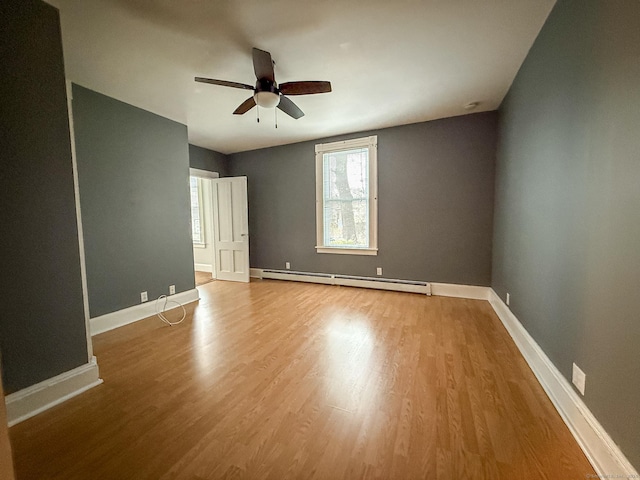 30 Merrimac St, Watertown, CT 06779 - empty room featuring a ceiling fan, baseboards, wood finished floors, and a baseboard radiator