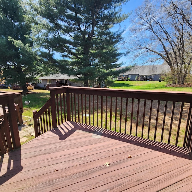 wooden terrace with a yard