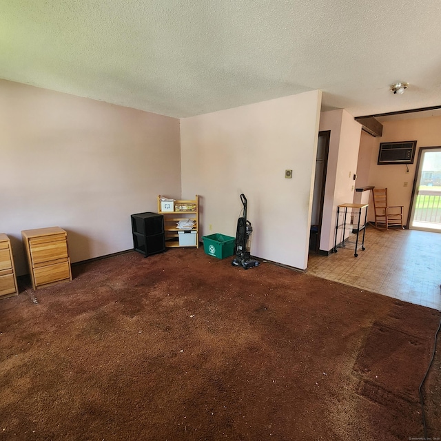 interior space with a textured ceiling and carpet floors