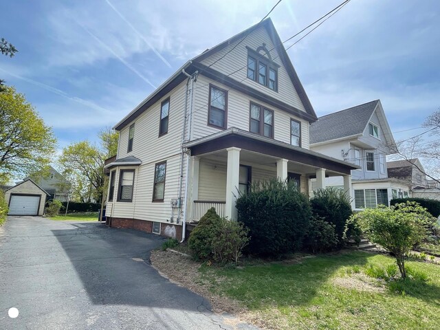 408 Blohm St, West Haven, CT 06516 - view of side of property featuring an outbuilding, covered porch, driveway, and a detached garage
