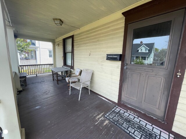 408 Blohm St, West Haven, CT 06516 - wooden deck featuring a porch