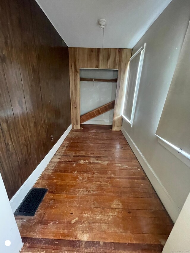 408 Blohm St, West Haven, CT 06516 - hall featuring wood walls, visible vents, baseboards, and hardwood / wood-style flooring