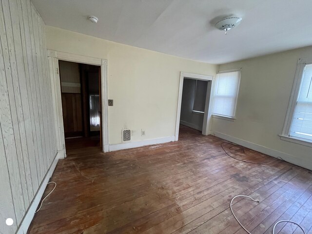 408 Blohm St, West Haven, CT 06516 - unfurnished bedroom featuring baseboards, visible vents, hardwood / wood-style flooring, and a closet