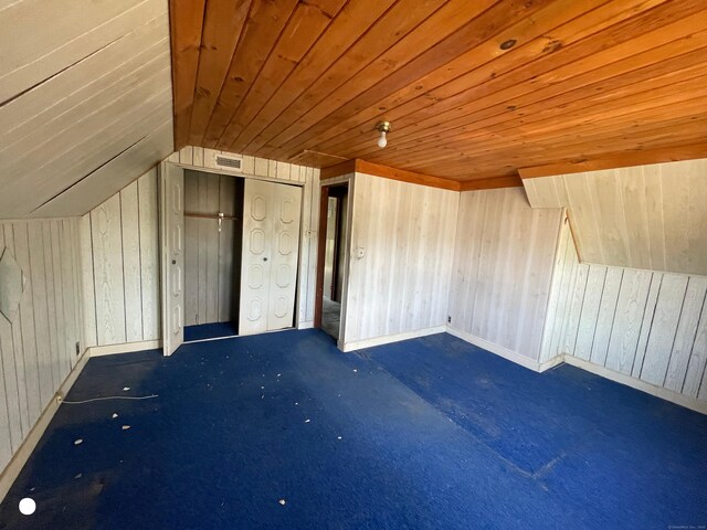 408 Blohm St, West Haven, CT 06516 - bonus room featuring visible vents, carpet floors, wood walls, wooden ceiling, and vaulted ceiling