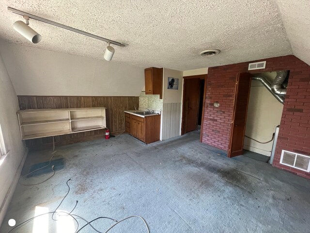 408 Blohm St, West Haven, CT 06516 - interior space featuring wood walls, a textured ceiling, visible vents, and wainscoting