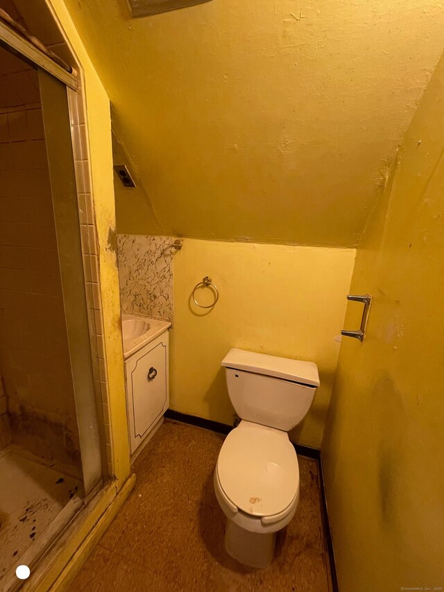 408 Blohm St, West Haven, CT 06516 - bathroom featuring vanity, visible vents, toilet, a stall shower, and vaulted ceiling