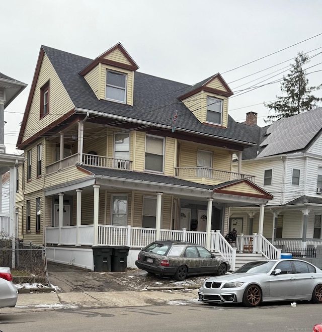 view of front of house featuring a porch and roof with shingles
