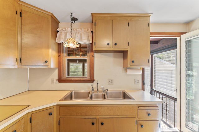 kitchen featuring a sink and light countertops