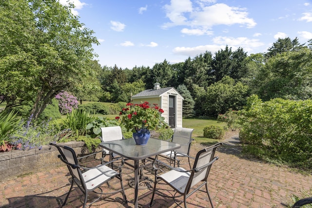 259 N Main St, Stonington, CT 06378 - view of patio / terrace featuring outdoor dining space and a storage shed