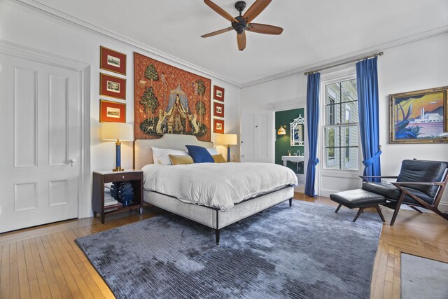 259 N Main St, Stonington, CT 06378 - bedroom featuring ornamental molding, hardwood / wood-style floors, and a ceiling fan