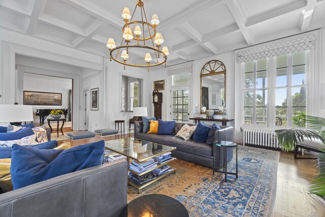 259 N Main St, Stonington, CT 06378 - living room with coffered ceiling, hardwood / wood-style floors, beam ceiling, a chandelier, and ornamental molding