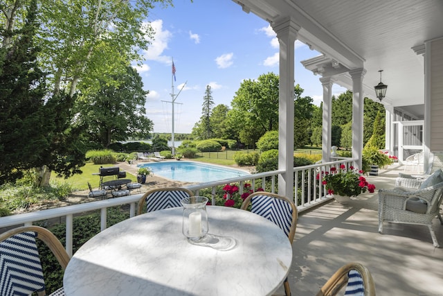 259 N Main St, Stonington, CT 06378 - balcony with view of pool area and outdoor dining space