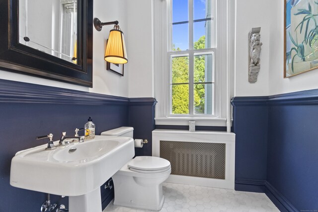 259 N Main St, Stonington, CT 06378 - bathroom with radiator heating unit and tile patterned flooring