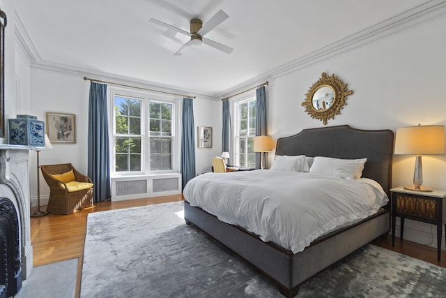 259 N Main St, Stonington, CT 06378 - bedroom with radiator heating unit, ornamental molding, wood finished floors, and ceiling fan