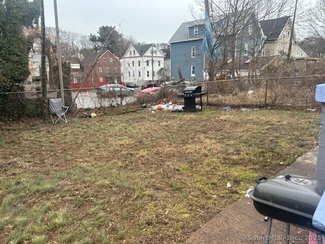 view of yard featuring a residential view