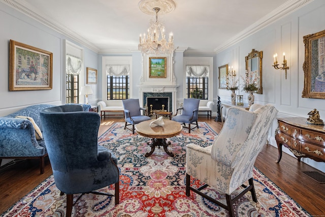 828 Sasco Hill Rd, Fairfield, CT 06824 - sitting room featuring a chandelier, wood finished floors, crown molding, and a premium fireplace