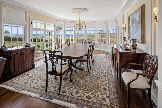 828 Sasco Hill Rd, Fairfield, CT 06824 - dining space featuring a chandelier, wood finished floors, and plenty of natural light