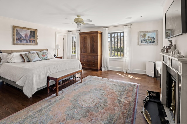 828 Sasco Hill Rd, Fairfield, CT 06824 - bedroom featuring baseboards, a fireplace, ornamental molding, wood finished floors, and a ceiling fan