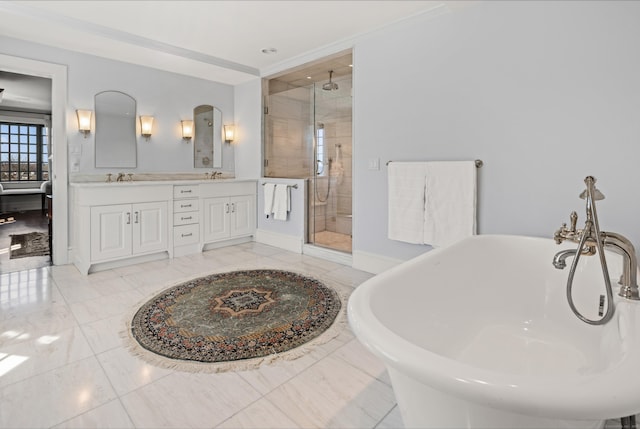 828 Sasco Hill Rd, Fairfield, CT 06824 - full bathroom featuring a soaking tub, a shower stall, double vanity, and baseboards