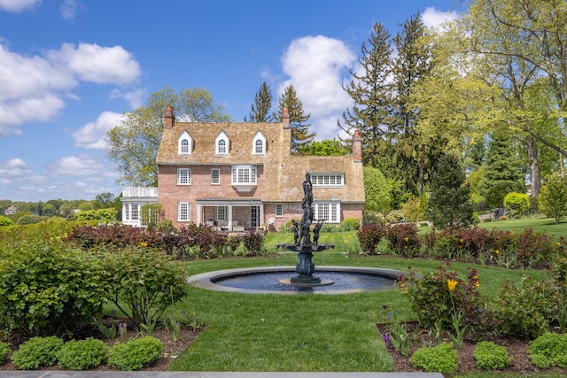 828 Sasco Hill Rd, Fairfield, CT 06824 - view of front of home with a front yard and a chimney