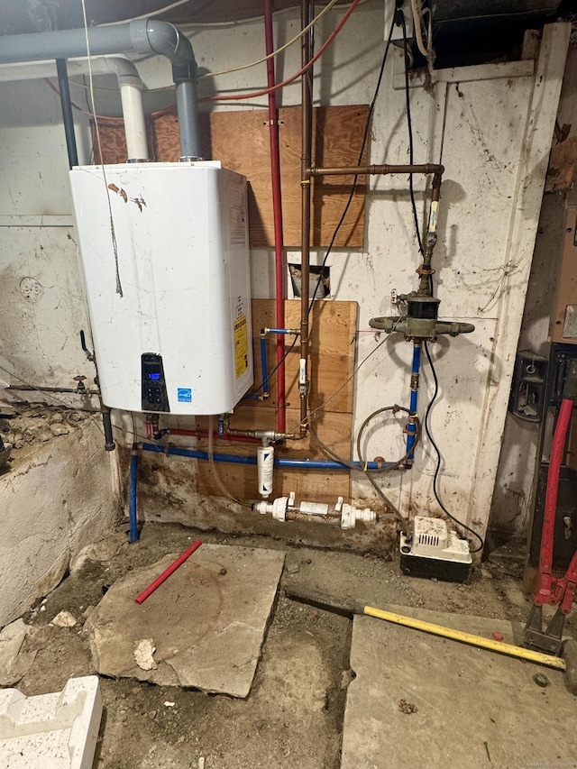 utility room featuring water heater