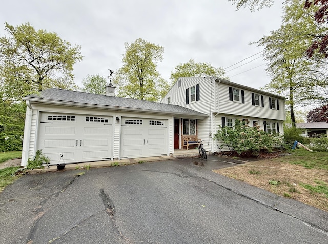 5 Hampton Rd, Enfield, CT 06082 - colonial home with a chimney, asphalt driveway, and a garage