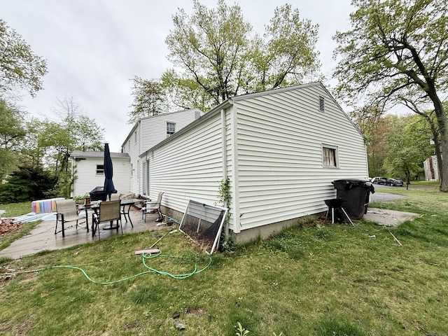 5 Hampton Rd, Enfield, CT 06082 - view of home's exterior featuring a patio area and a lawn