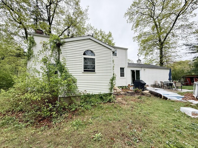 5 Hampton Rd, Enfield, CT 06082 - rear view of house with a chimney and a yard
