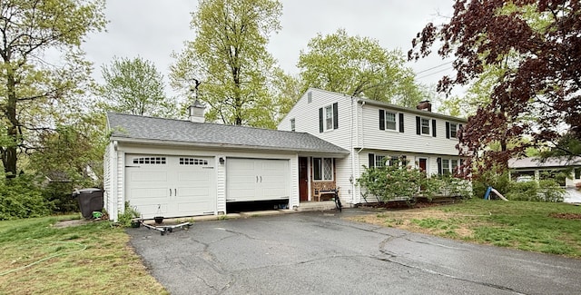 5 Hampton Rd, Enfield, CT 06082 - colonial house with a chimney, a garage, driveway, and a front lawn