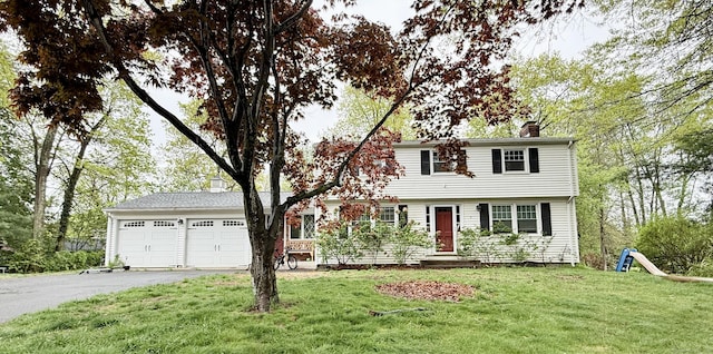 5 Hampton Rd, Enfield, CT 06082 - colonial inspired home featuring a chimney, asphalt driveway, an attached garage, and a front lawn